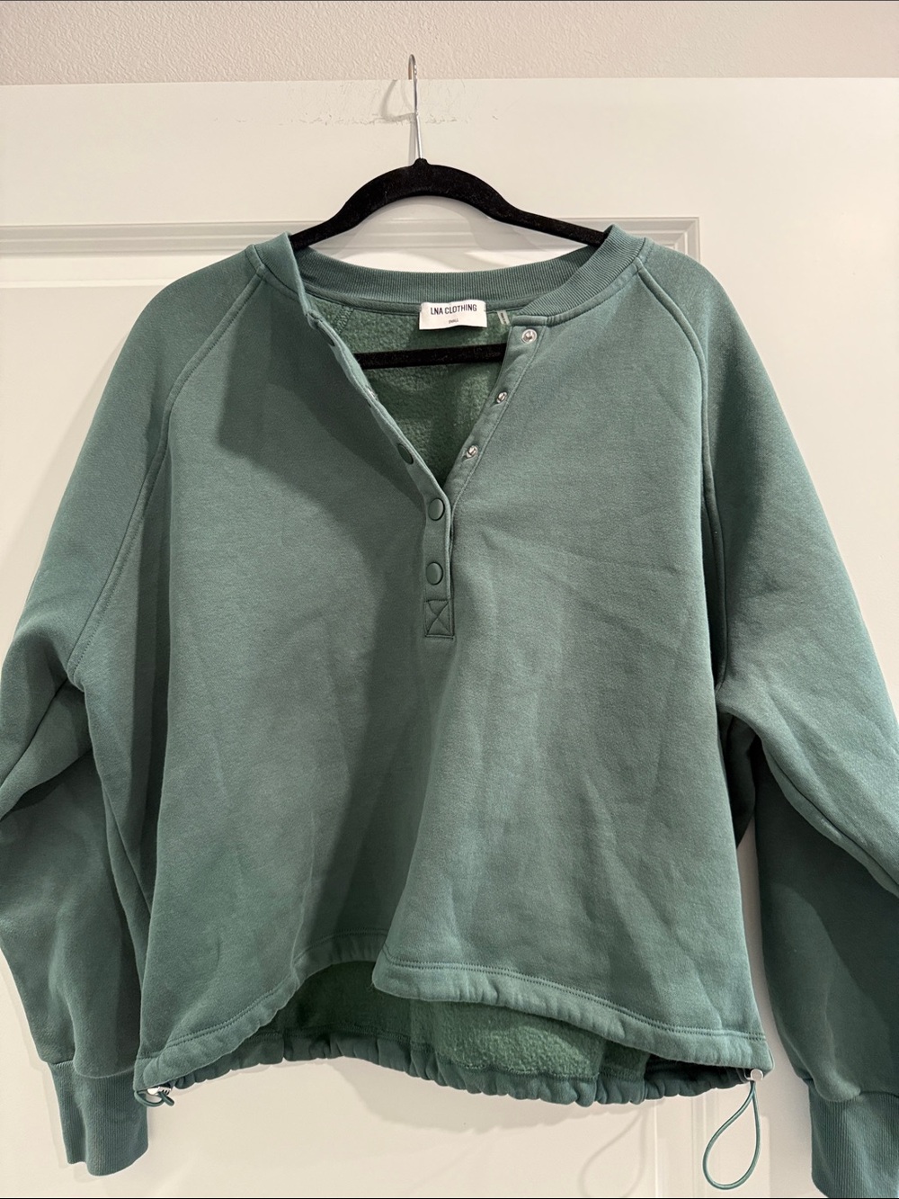 LNA Joey Henley Sweatshirt featuring a snap-front neckline. sz s